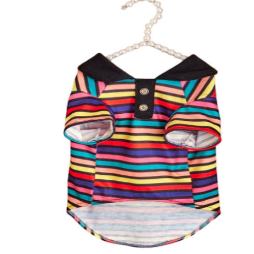 Colorful striped dog dress on a hanger against a white background