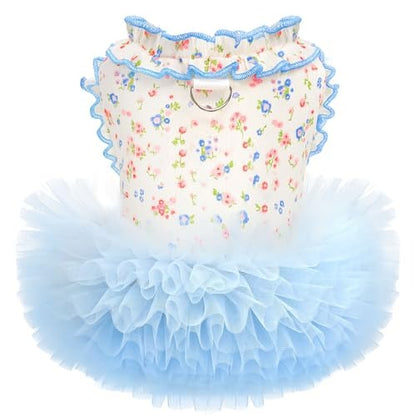 Children's outfit with floral top and blue tutu skirt on a white background